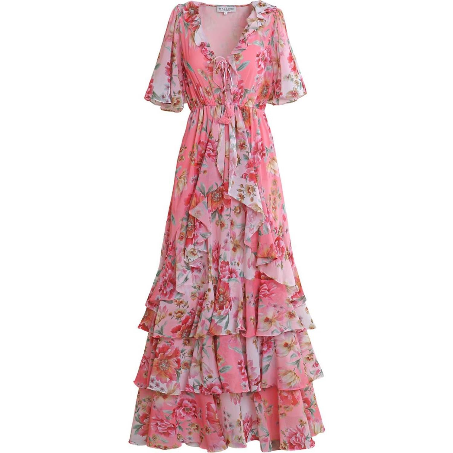 Hale Bob Carina kjole i korallfarge med elegant snitt og blomsterprint, vist på modell.