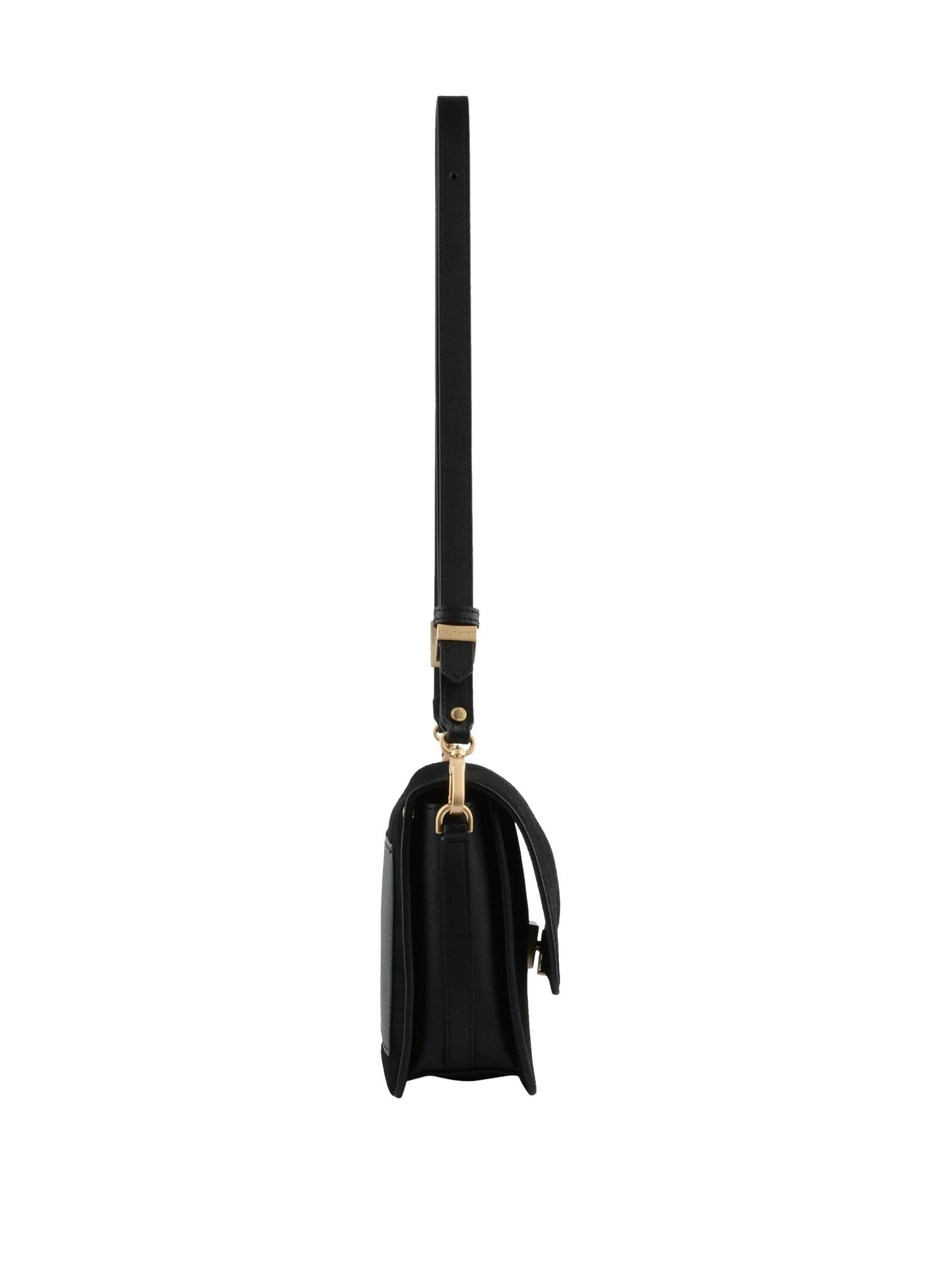 Sort veske i anjou skinn fra Pourchet Paris med mykt suede-materiale og elegant design, vist fra siden.