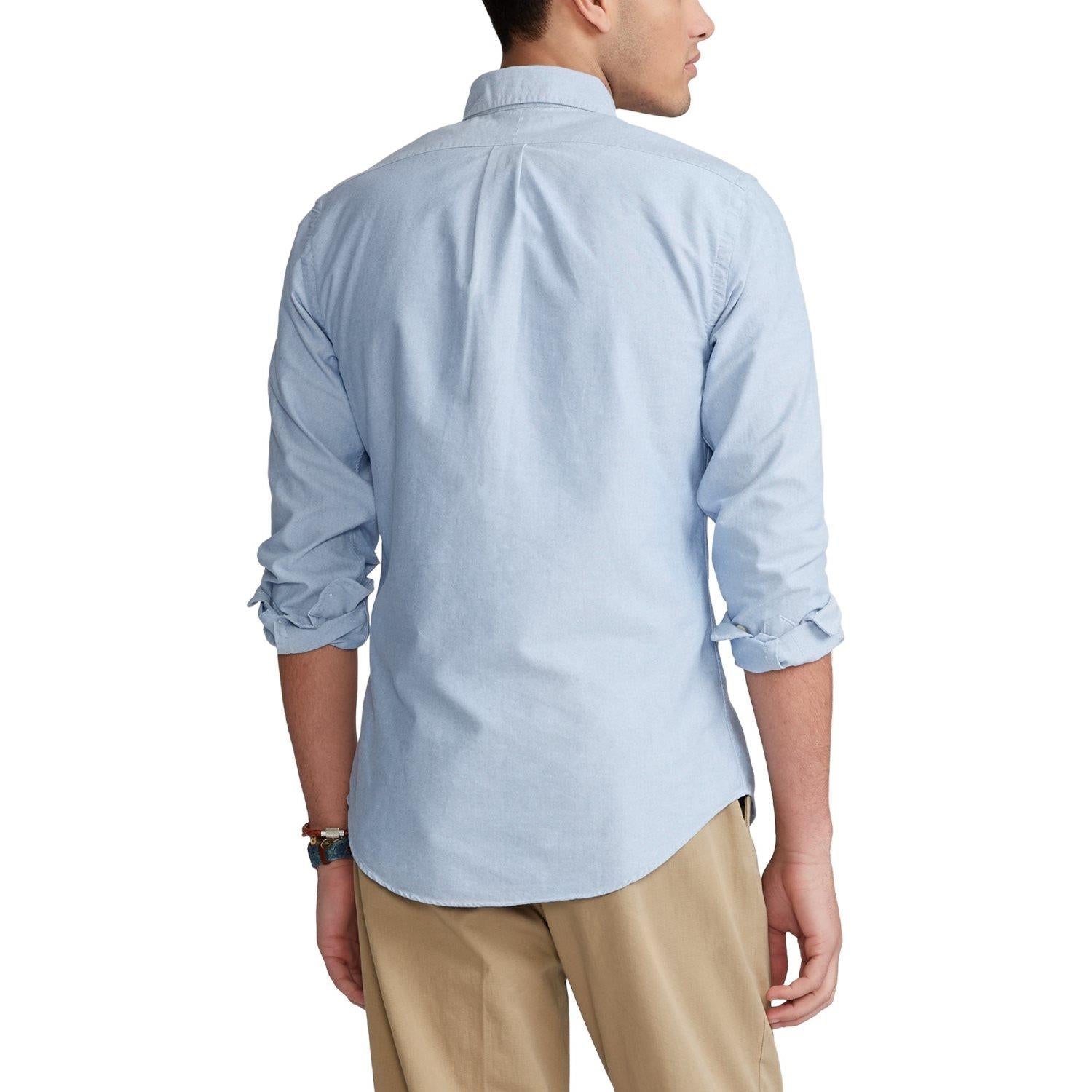 Lyseblå Polo Ralph Lauren Oxford slim fit skjorte med klassisk krage og knappestolpe, vist på flat visning