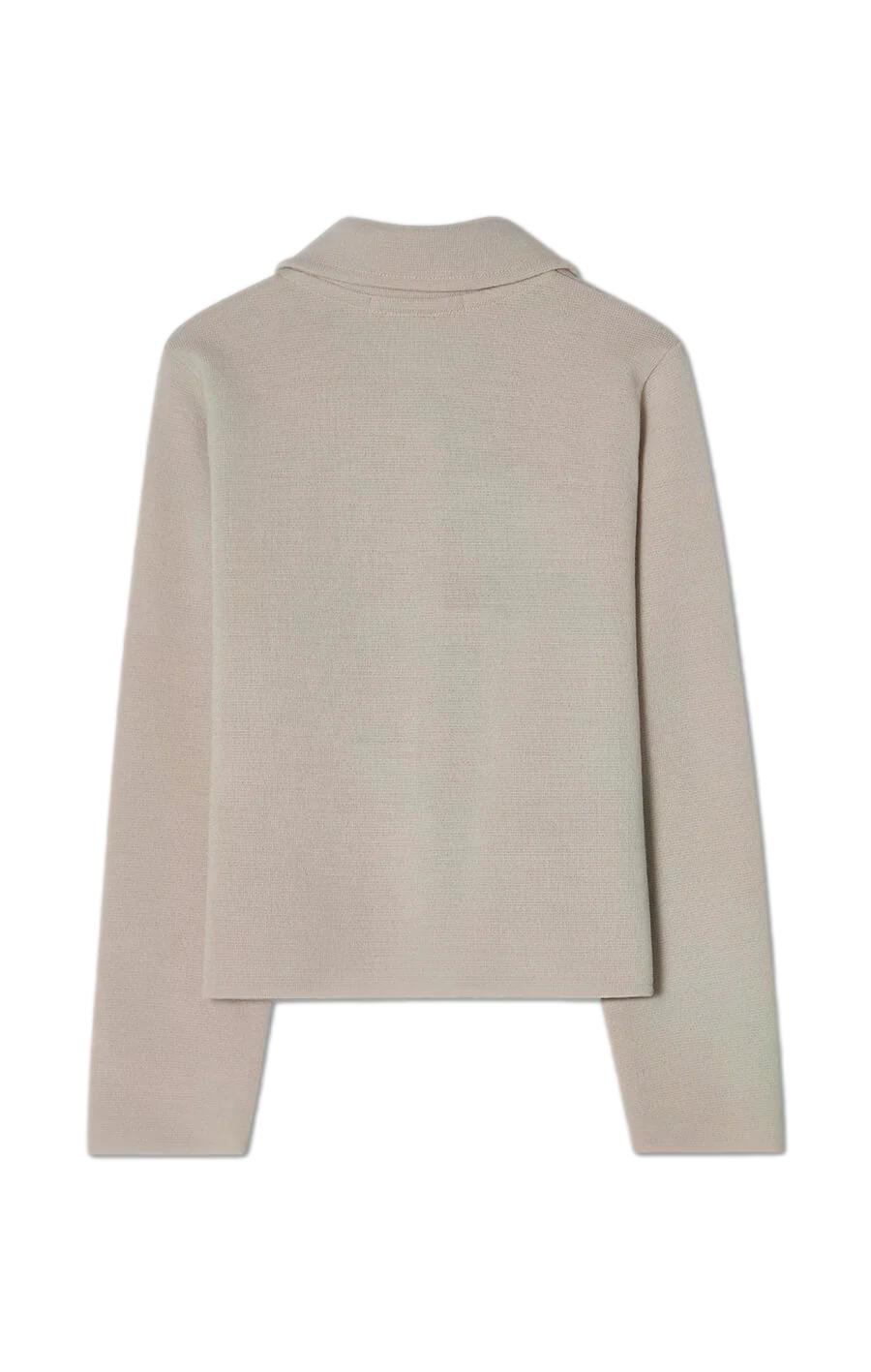 Busnel Catherine lys-beige jakke, myk og elegant, vist på modell med krage og glidelås, perfekt for kaldt vær.