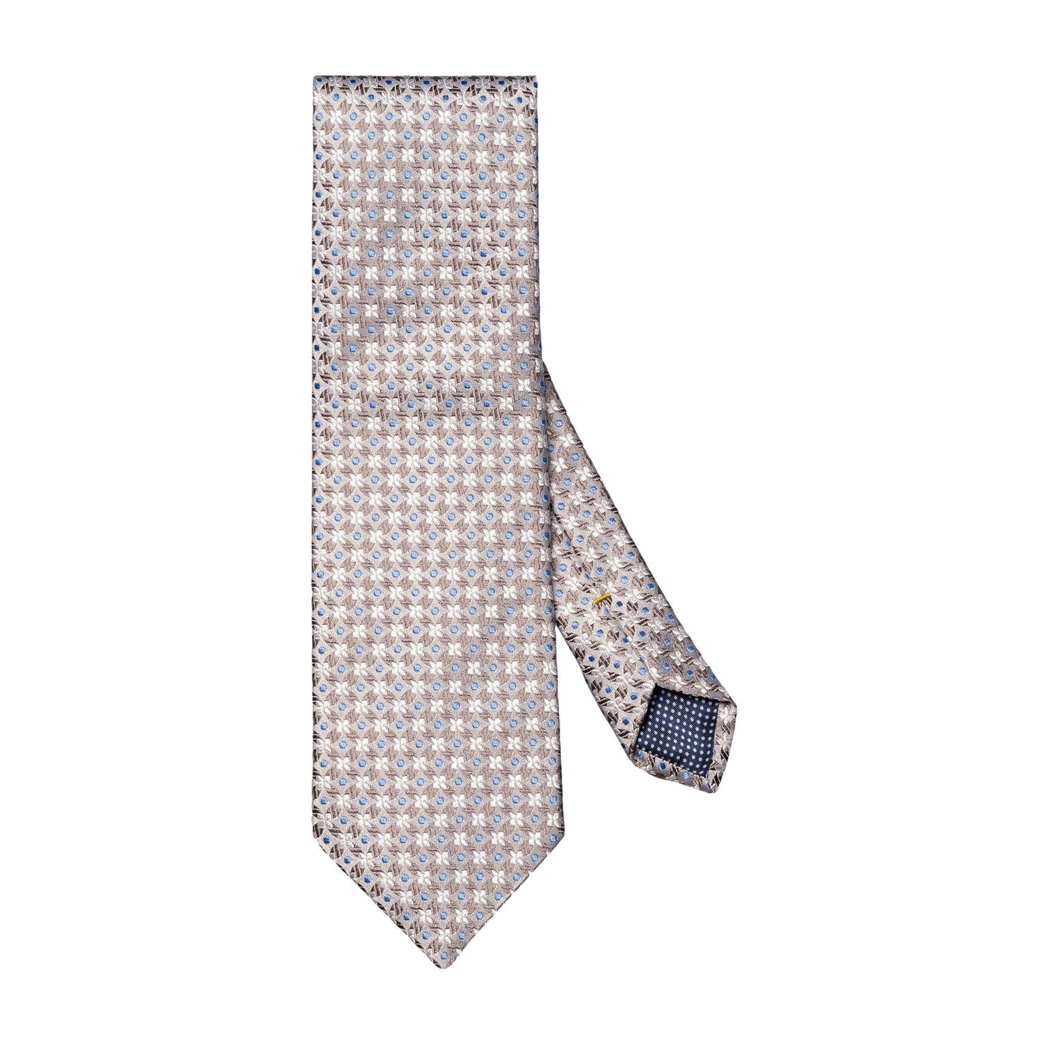 Eton sølvfarget slips med blomsterprint i silke, elegant til formelle anledninger, vises med detaljert mønster og glans.