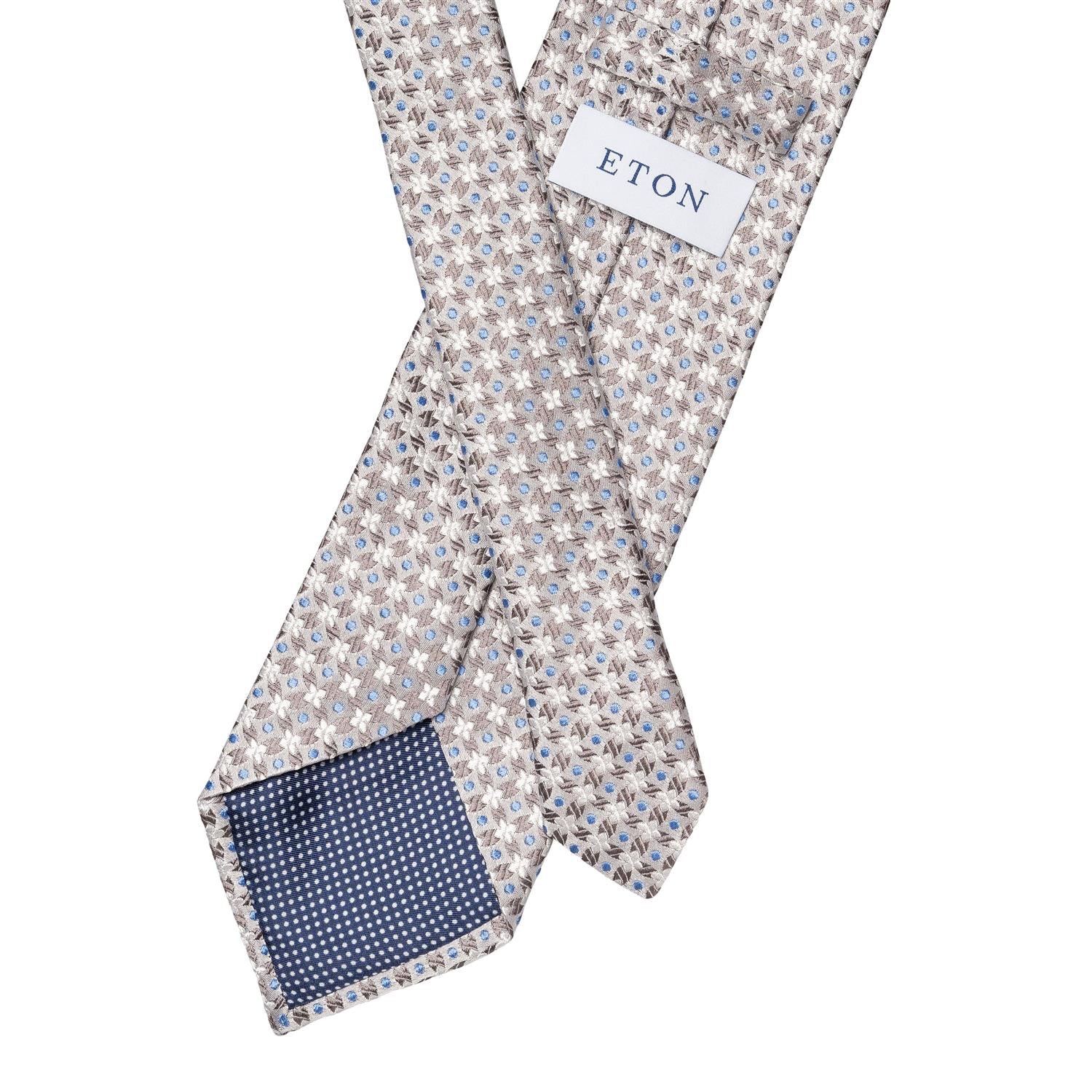 Eton sølv silkeslips med blomsterdesign, elegant slips i sølvfarge for formelle anledninger.